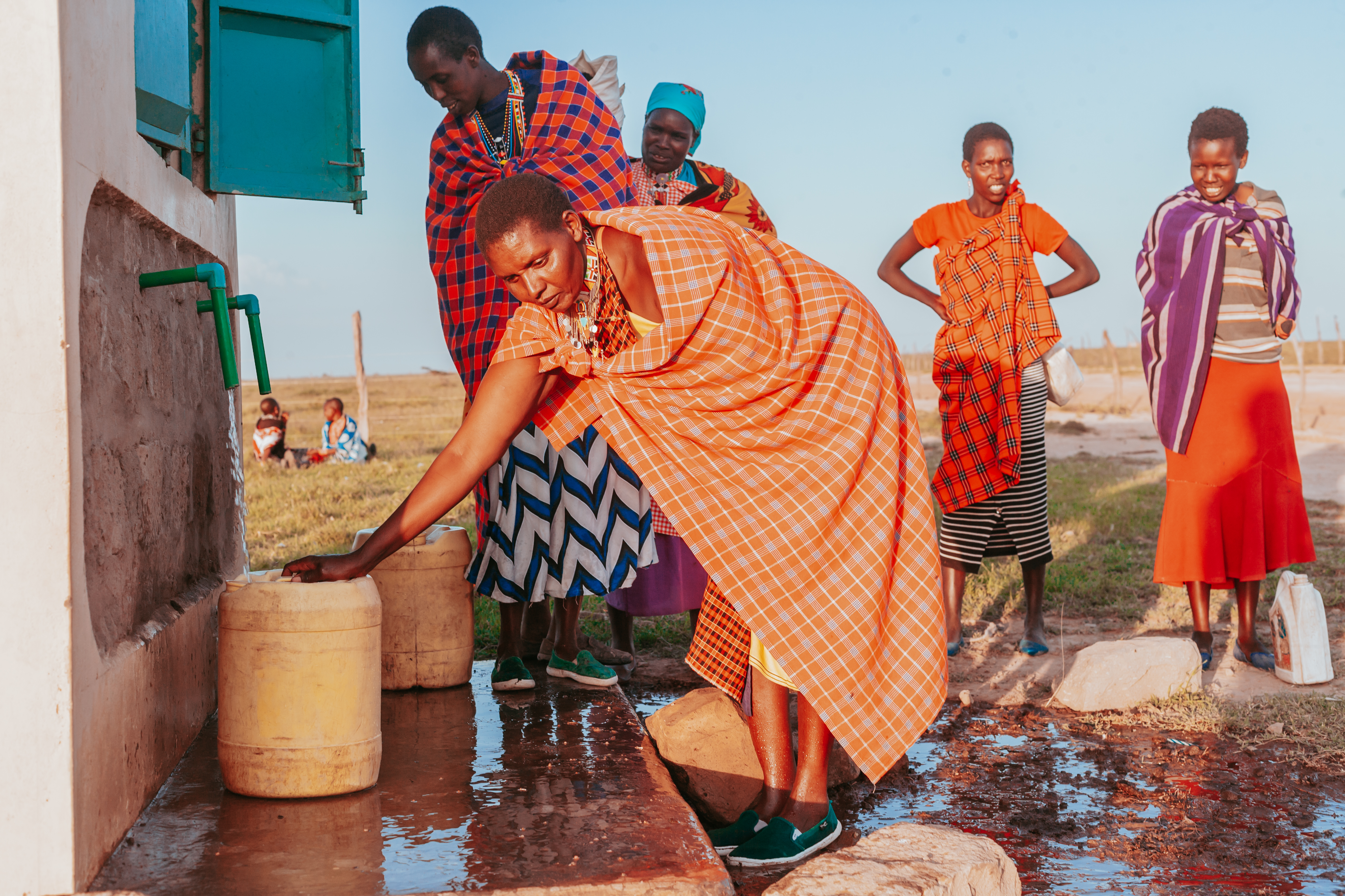 A group of Masaai women collecting clean water from the water point that PFP installed at Osupukiai Village, Narok County, Kenya.